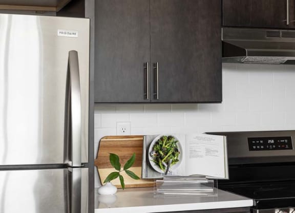 a kitchen with a refrigerator and a sink