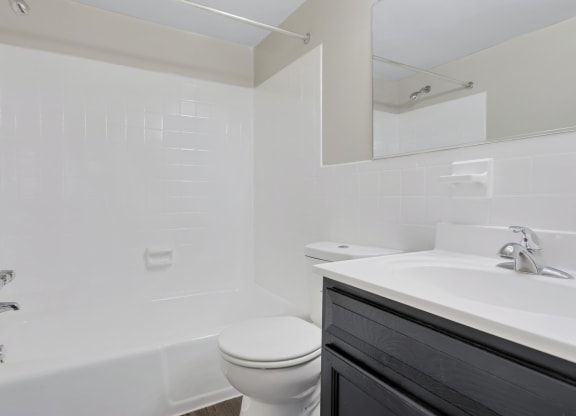 a bathroom with a toilet and a sink