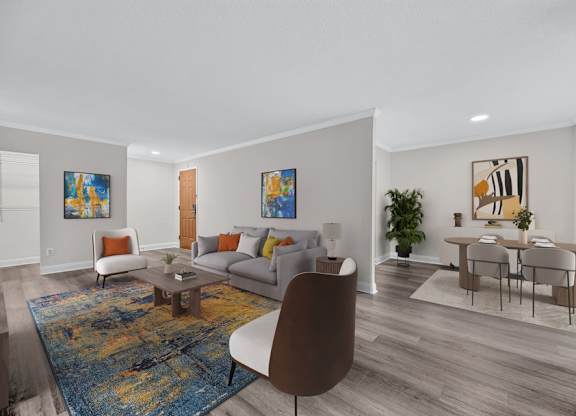 A living room with a brown chair and a blue rug.
