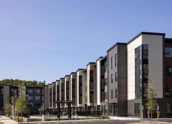 a row of apartment buildings on a city street