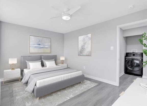 a bedroom with a bed and a ceiling fan