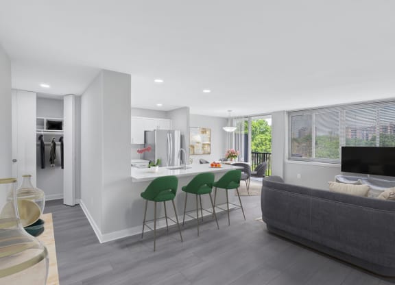 a living room with a kitchen and a couch