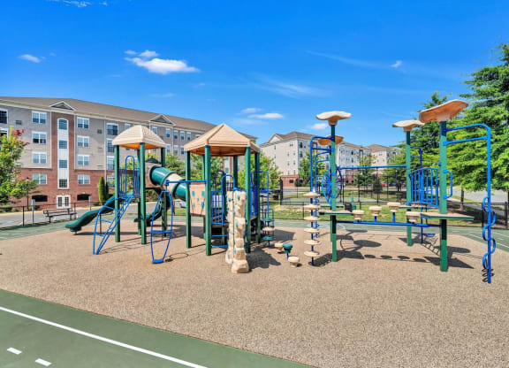 playground with play equipment and buildings
