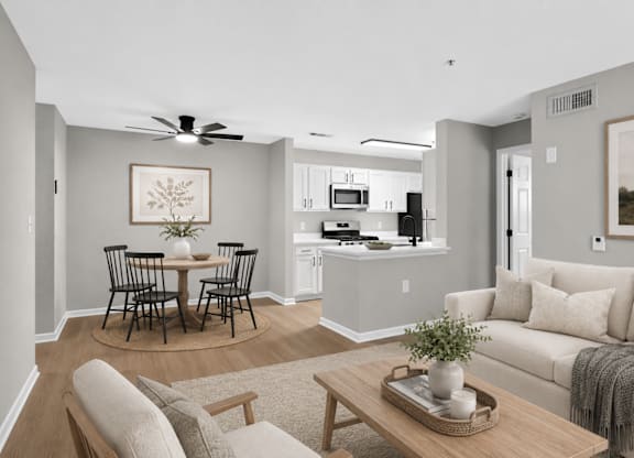 A living room with a dining table and chairs.