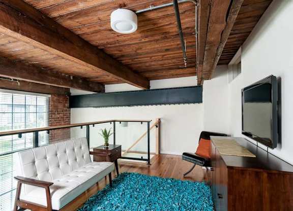 a living room with a couch and a television