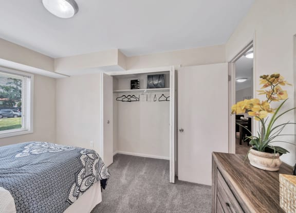 a bedroom with a bed and a mirror
