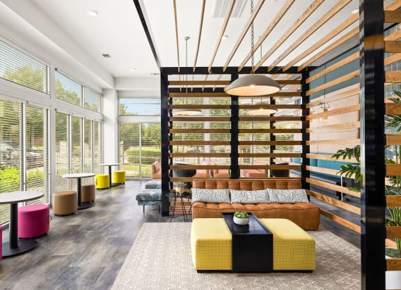 a lounge area with a couch and tables