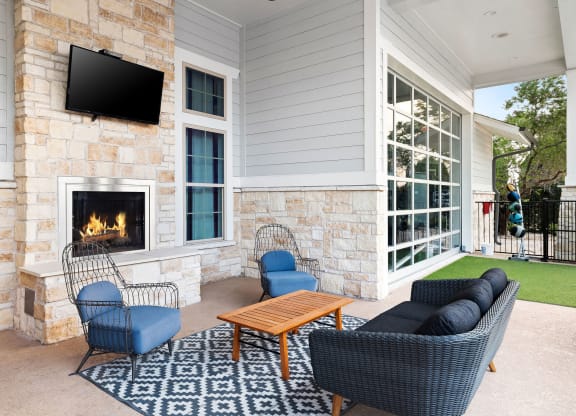 Outdoor Lounge with Fireplace and Comfy Seating