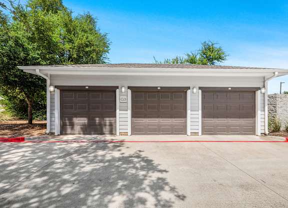 a parking lot with two garage doors