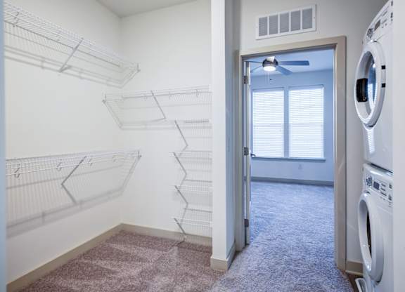 A laundry room with a washer and dryer in it.