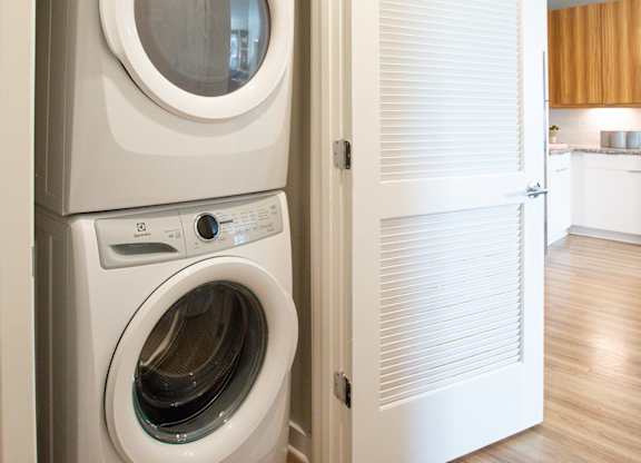 a small laundry room with a washer and dryer
