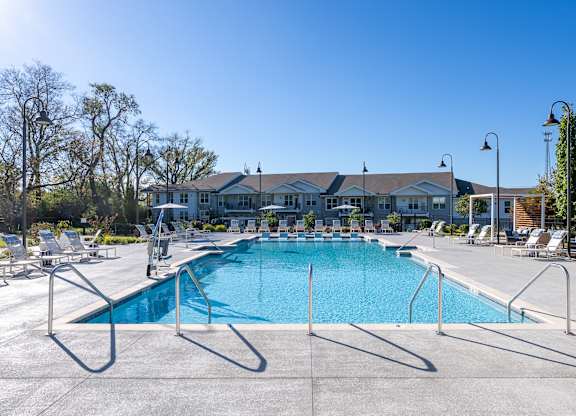 A large swimming pool with a metal fence around it.