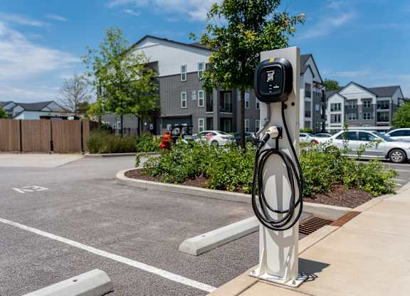 A charging station for electric vehicles is located in a parking lot.