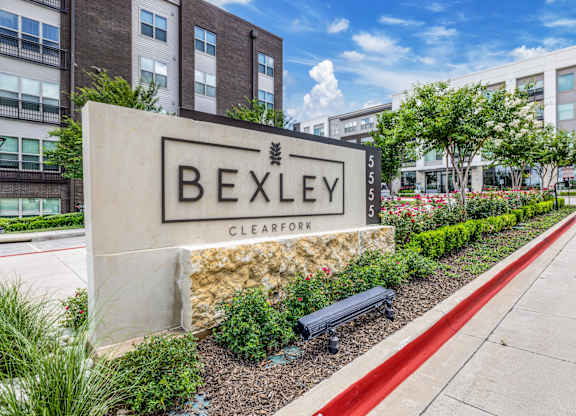 A sign that says Bexley in front of a building.