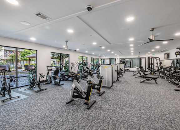 A spacious gym with a variety of exercise equipment.