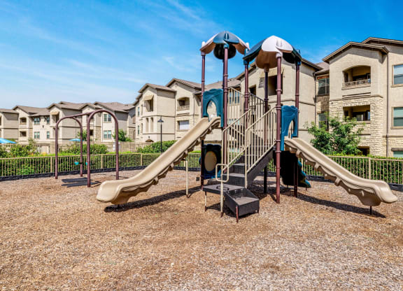 Playground with slides and two swings