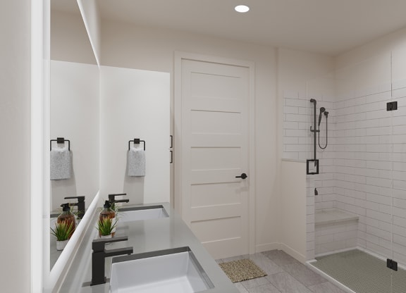 a white bathroom with a shower and a sink