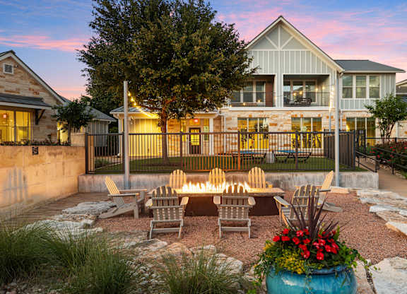 A house with a patio and a fire pit.