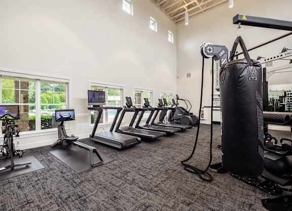 the gym with cardio equipment at the preserve at polk apartments