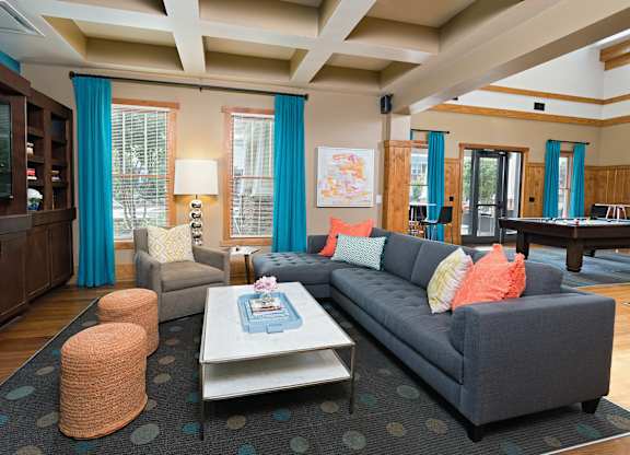 A living room with a grey couch and a coffee table.