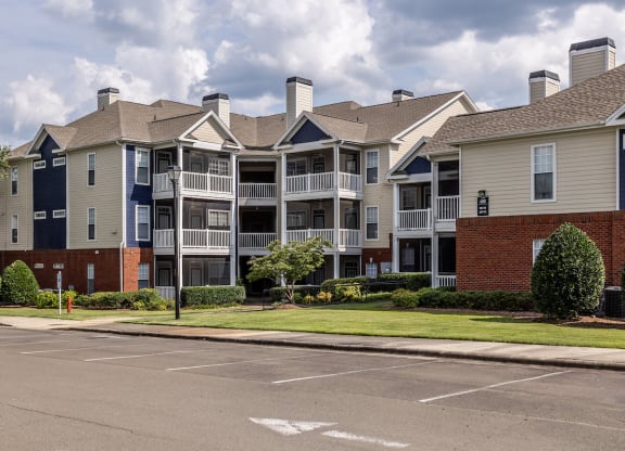 an apartment building on the corner of a street