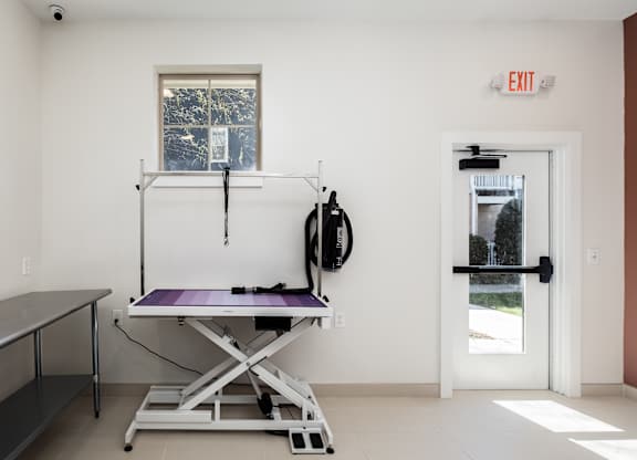 A room with a table and a window.