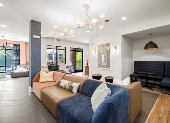 a living room with a couch and a piano