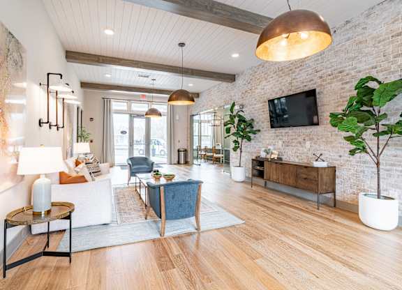 a living room filled with furniture and a flat screen tv
