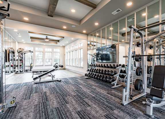 the gym at the enclave at woodbridge apartments in sugar land, tx
