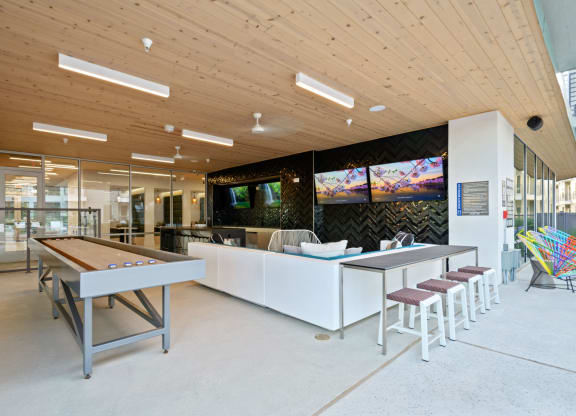 Covered Poolside Sports Lounge with TVs and Shuffleboard