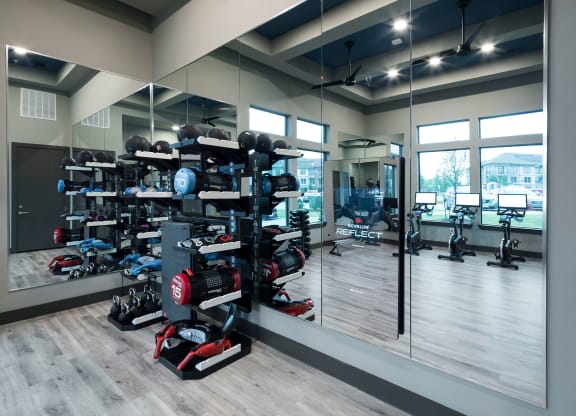 a row of red and black motorcycles in a mirrored room