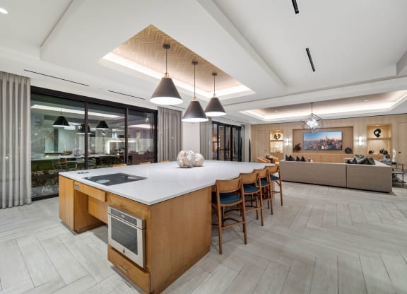 a large kitchen with a large island and chairs