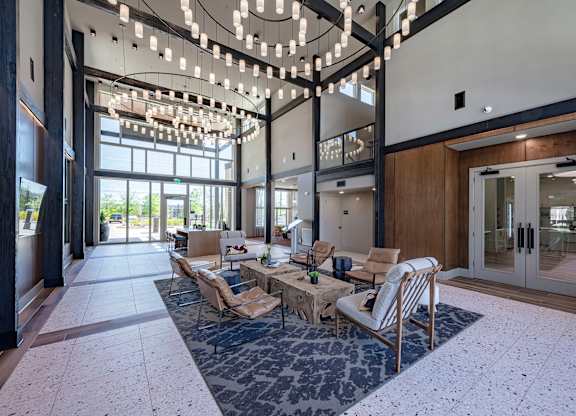 a view of the lobby atrium at the preserve at great pond apartments in windsor