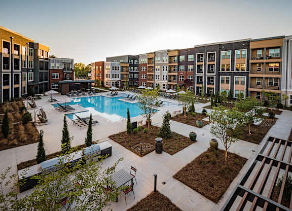 an aerial view of the courtyard and pool at the bradley braddock road station apartments