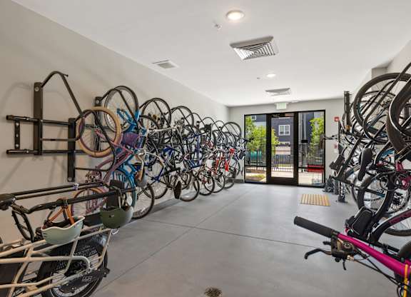 A bike rack with many bikes parked.
