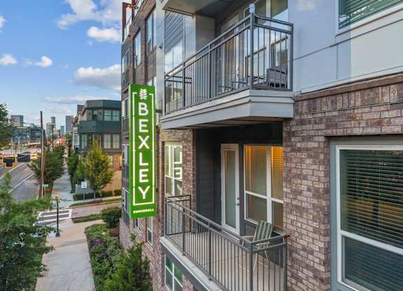 A building with a green sign that says Bexley.
