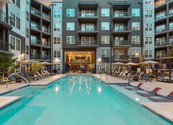 A large indoor swimming pool in a residential building.