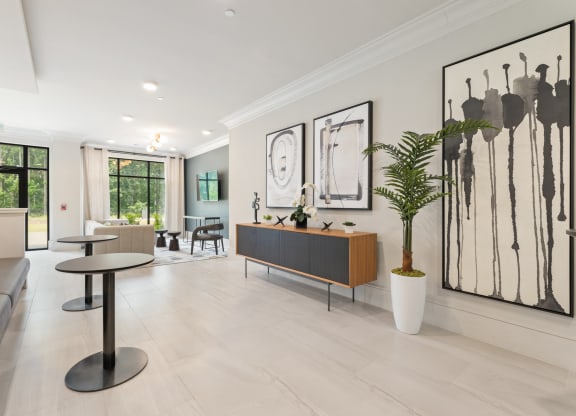 a living room filled with furniture and a large window