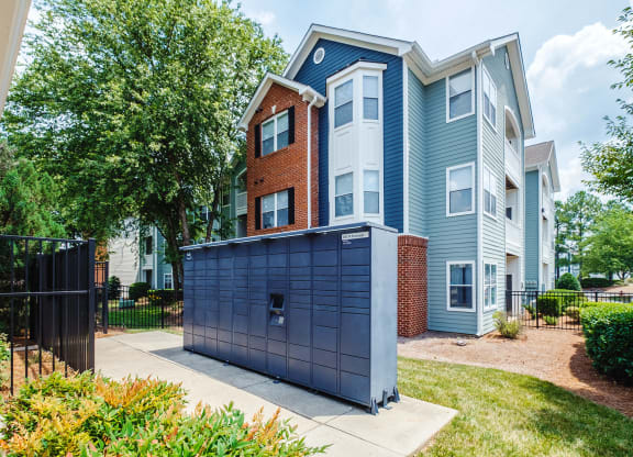 a blue and brick apartment building with a blue garage door