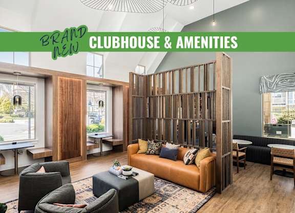 A modern clubhouse and amenities area with a large window and wooden walls.