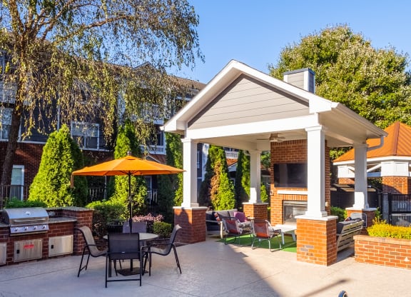 a swimming pool with a patio and a house with a pool