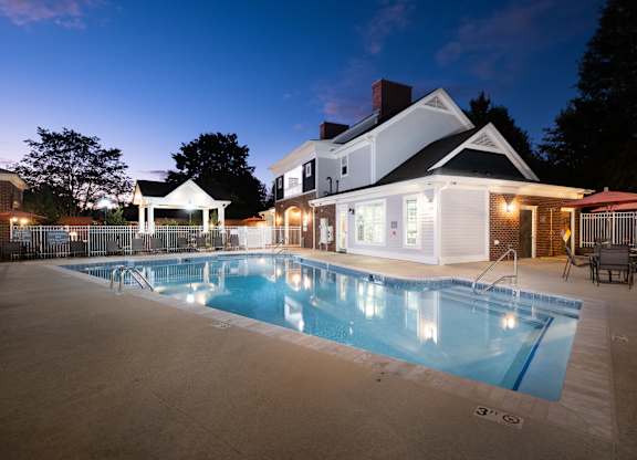 A large house with a pool in the backyard.