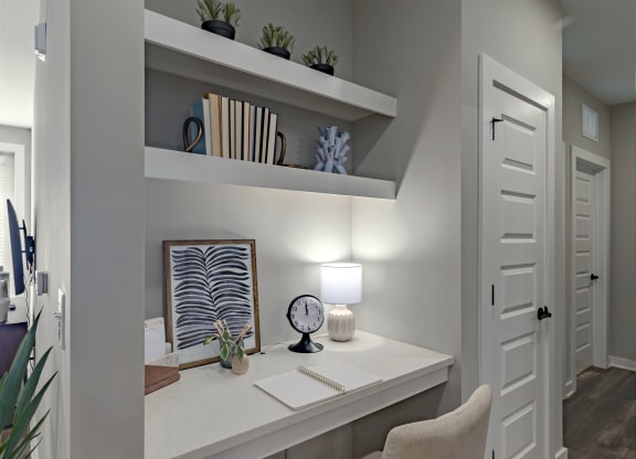 a home office with a desk and a chair