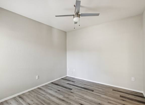 A room with a ceiling fan at Sweetwater At Metro North Apartments, Arizona 85029