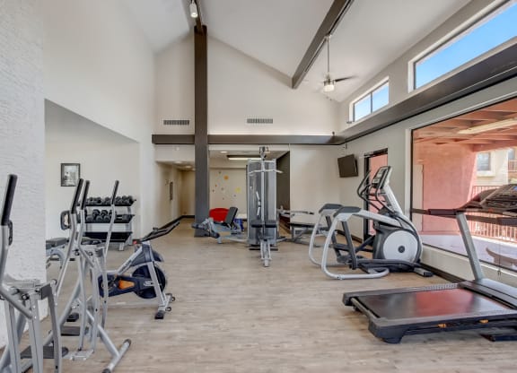 Gym with cardio equipment and weights at the Glen at Mesa Apartments, Mesa, Arizona 85201
