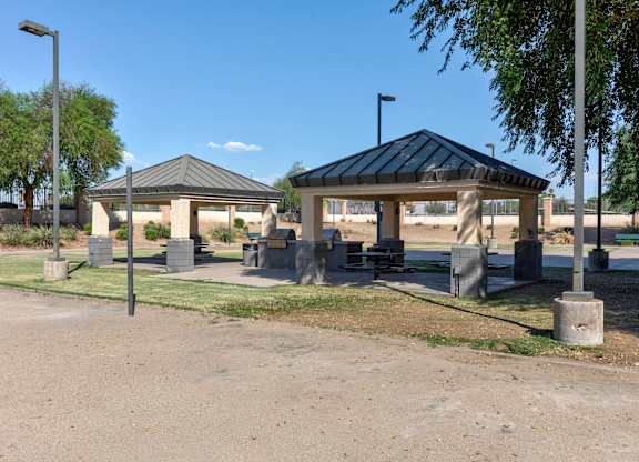 A gazebo-like structure sits in the middle of a park-like setting at Sweetwater At Metro North Apartments, Phoenix, Arizona