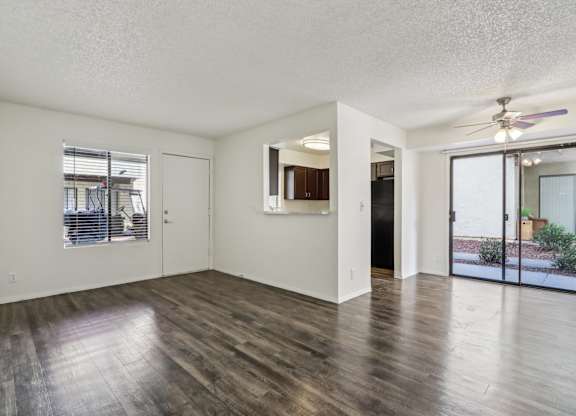 A room with wooden floors and white walls.