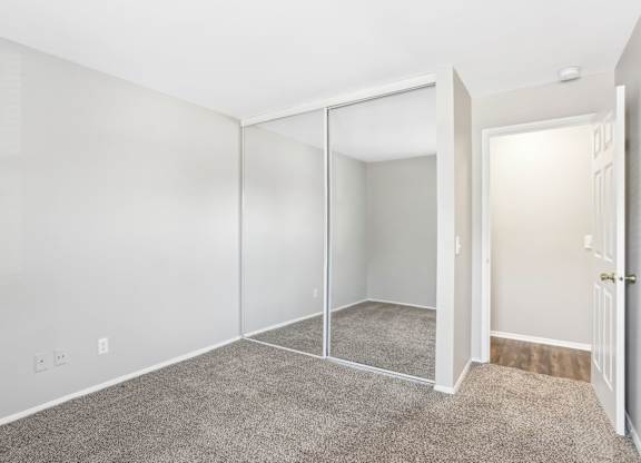 A room with white walls and a carpeted floor. at Millennium at Creve Coeur, Missouri