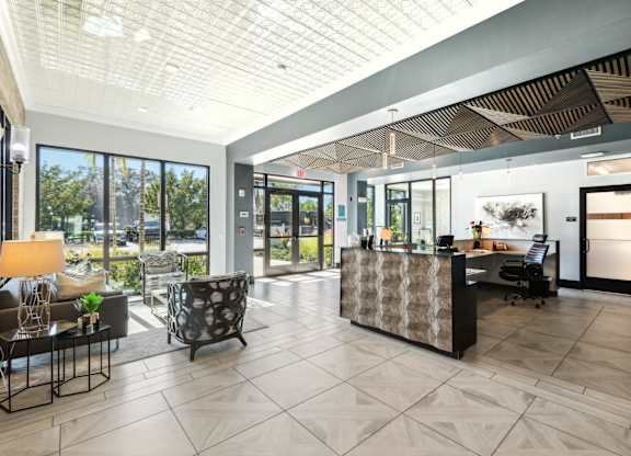 A reception area with a desk and chairs.
