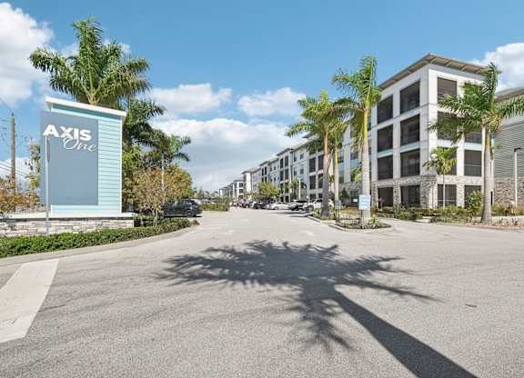 Axis One sign in front of a row of buildings.